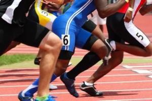 three men reaching the finish line 